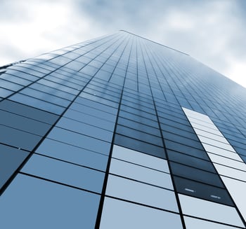 view of a corporate skyscraper from the bottom